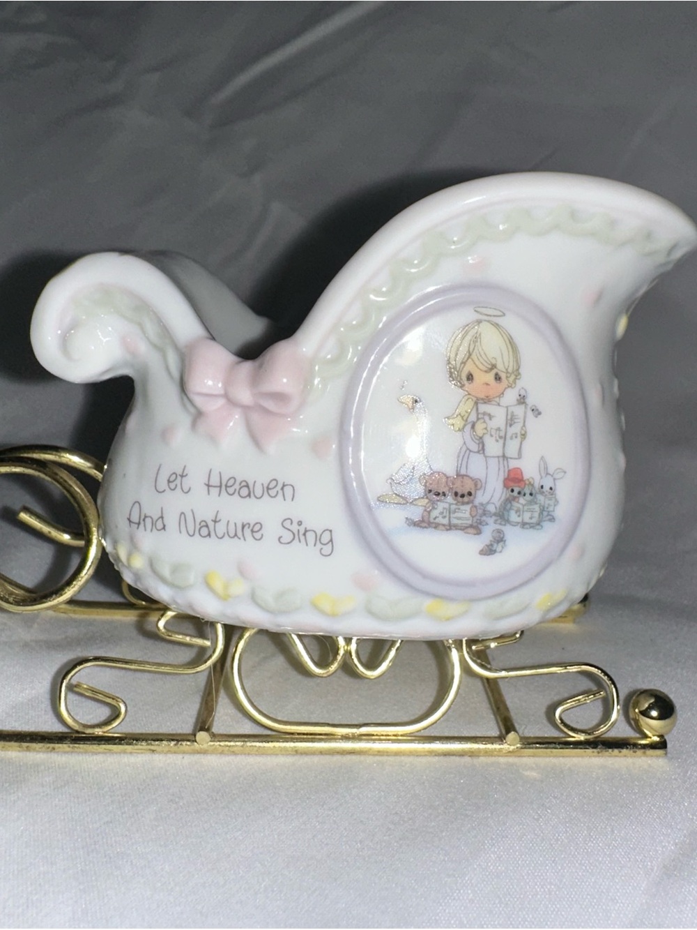 Precious moments let heaven and nature sing sleigh with gold stand